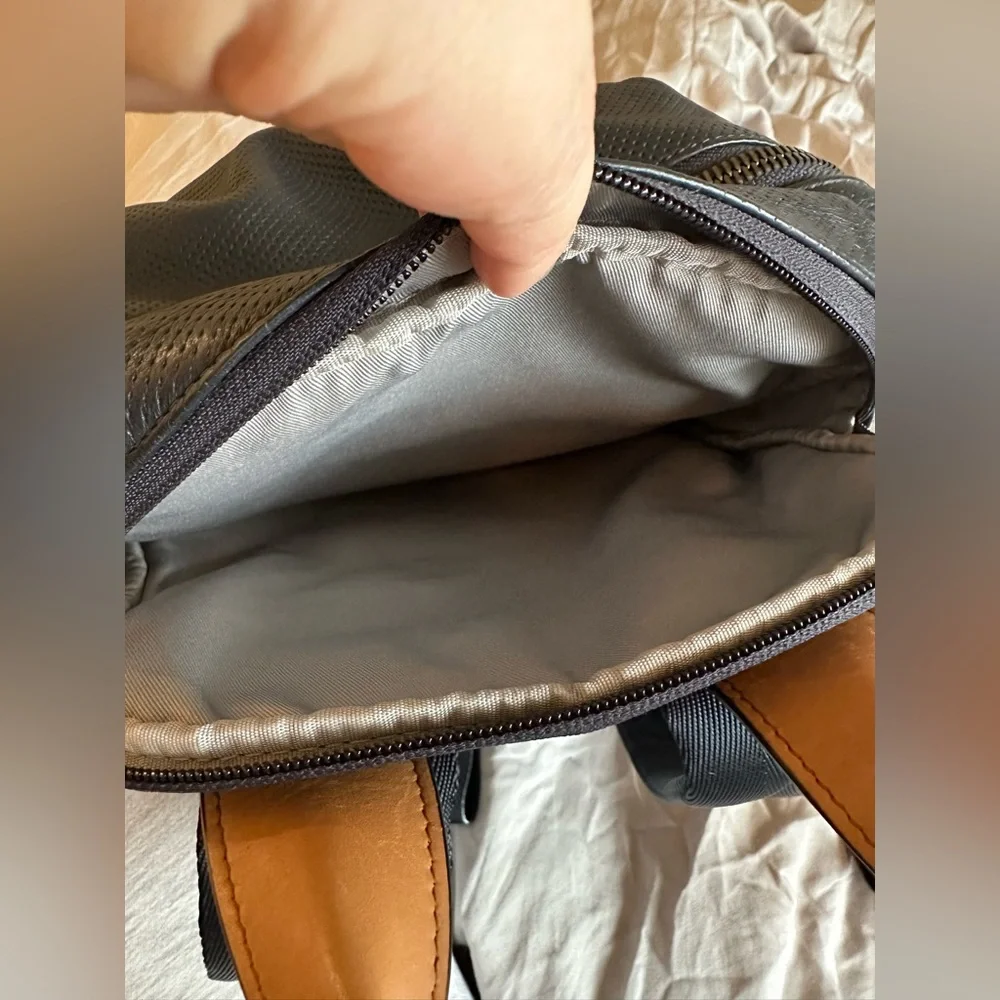Tumi Navy Perforated Leather Backpack with Tan Handles